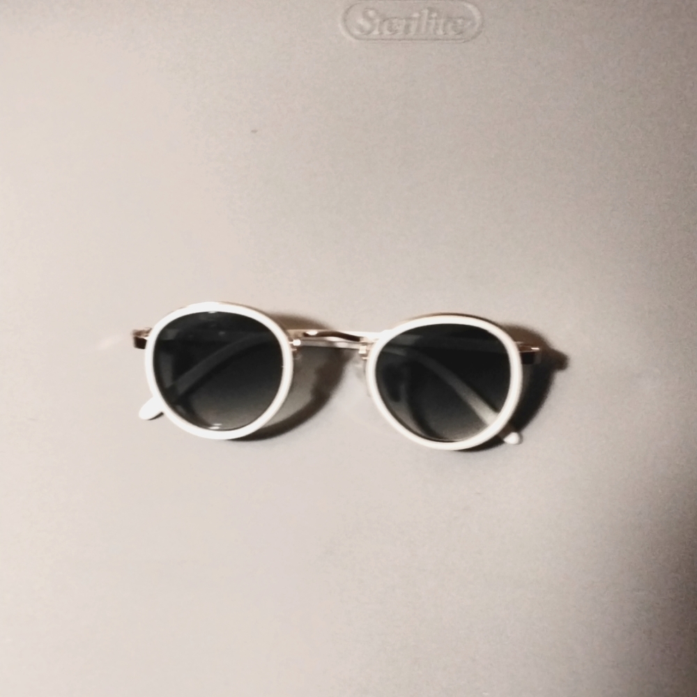 A pair of white sunglasses
